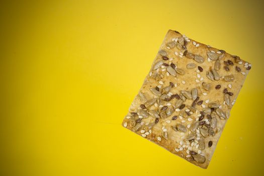 Salted crispy crackers with sesame and sunflower seeds