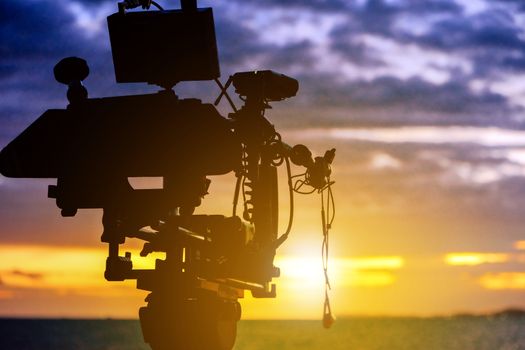 Film industry. Filming with sunset background
