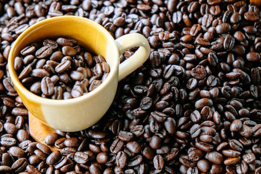 Cup of coffee with coffee beans