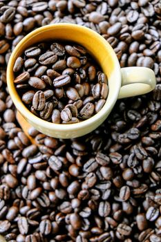 Cup of coffee with coffee beans