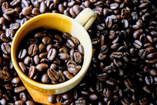 Cup of coffee with coffee beans