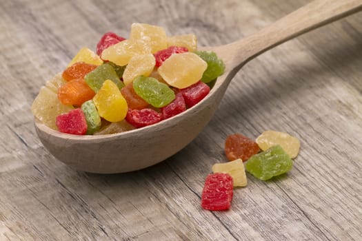  different dried fruits in wooden spoon on table