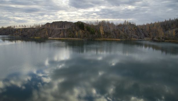 Autumn Forest Around the Lake in an Abandoned Quarry