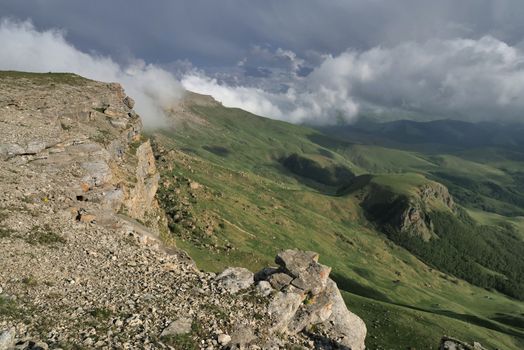 Rocky Mountains cliff and clouds fog. Nature landscape.