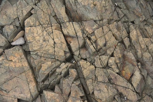 Natural stone background with cracks. Close up view.