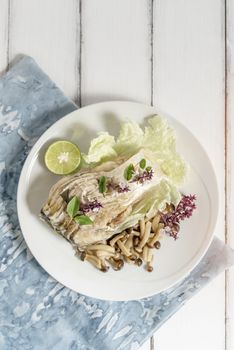 top view of fish dish over wooden background