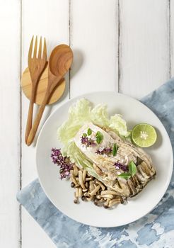 top view of fish dish over wooden background