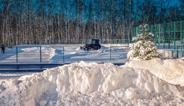 Removing snow from the pitch