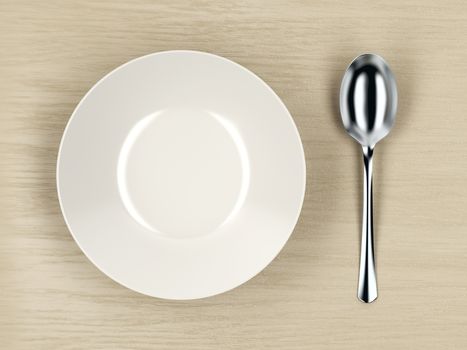 Top view of white empty soup bowl and silver spoon on wood table