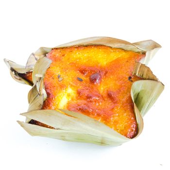 Single mini Bibingka, traditional Philippines cake isolated on white background. A Filipino baked rice with butter and cheese in banana leaves, usually eaten for breakfast, especially during Christmas season
