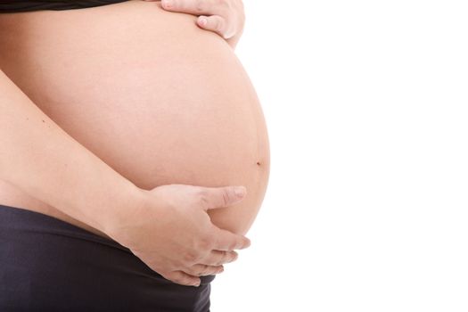 Closeup of pregnant woman at white background