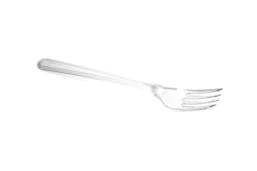 Transparent plastic fork isolated on white background. Close up