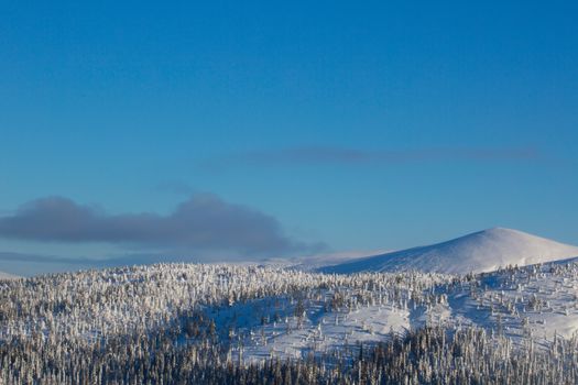 Landscape with snow covered mountain with panoramic view on Kandalaksha , ski resort
