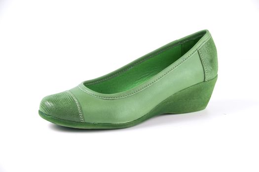 Female green leather shoes on white background, isolated product.