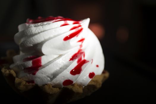 Cake Basket with cream and jam on a black background
