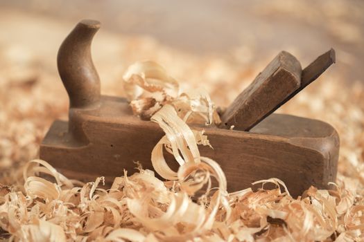 Old wooden hand plane for woodworking.