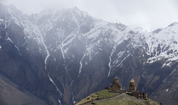 14th century Holy Trinity Church (Tsminda Sameba) near Mount Kazbek in Georgia