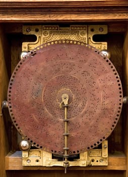  an ancient musical box, front image of disk with holes