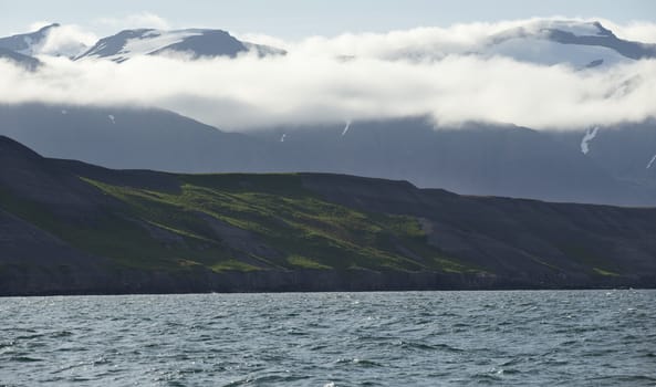 Typical icelandic landscape. Mountains and Seashore of the Atlantic Ocean.