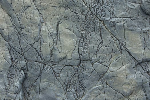 Natural stone background with cracks. Close up view.