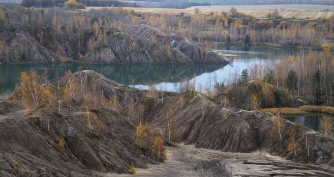 Autumn Forest Around the Lake in an Abandoned Quarry