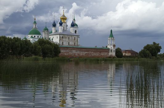 Spaso-Yakovlevsky monastery. Russia. Rostov the Great city. shot from the lake with reflection.