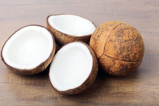 Group of fresh coconuts on wood background. 