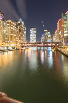 Riverside Chicago skylines at blue hour along Wells Street
