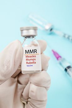 MMR vaccine for Measles, Mumps, and Rubella as outbreaks concept.