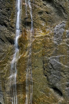 Beautiful waterfall in the Aare Canyon between Meiringen and Innertkirchen, Bernese Alps, Switzerland