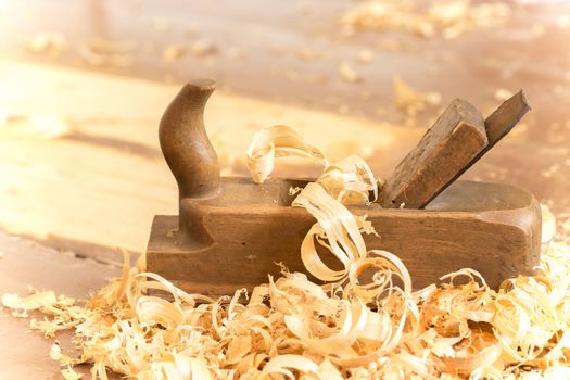 Old wooden hand plane for woodworking.