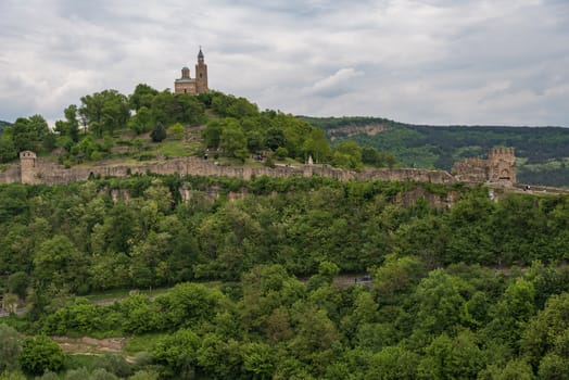 Panoramic view of the Tsarevets Fortress from ruins of Trapezitsa fortress. Veliko Tarnovo in Bulgaria.