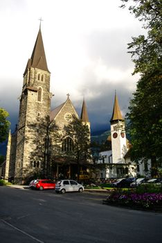 Interlaken, Switzerland - Agust 24, 2010: Castle church Schlosskirche and museum Schloss.