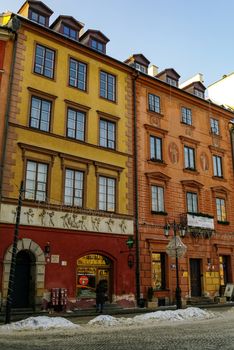 Warsaw, Poland -January 5, 2011: Houses in old town market square, Warsaw, Poland. Winter time with snow