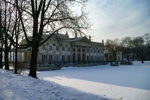 The Lazienki palace in Lazienki Park. Winter landscape with snow. Warsaw. Lazienki Krolewskie, Poland