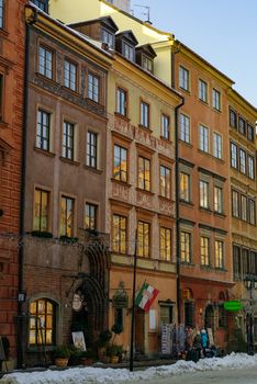 Warsaw, Poland -January 5, 2011: Houses in old town market square, Warsaw, Poland. Winter time with snow