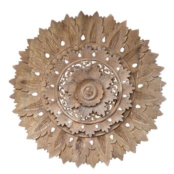 Wooden pattern of flower on carve teak wood in circle shape for decoration isolated on blackground with clipping path.