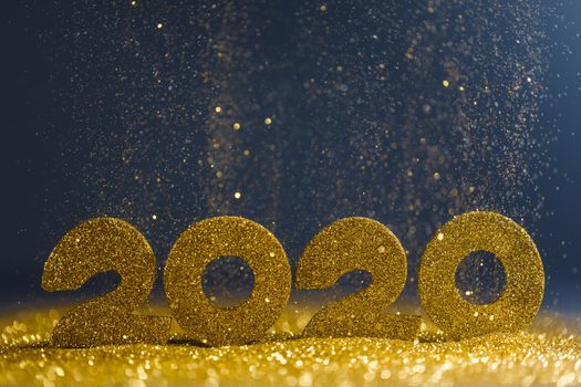 2020 New Year luxury design concept. Golden 2020 New Year horizontal template with golden glitter on blue backgound