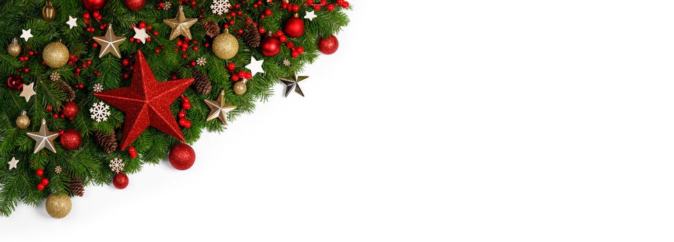 Christmas Border frame of tree branches on white background with copy space isolated, red and golden decor, berries, stars,