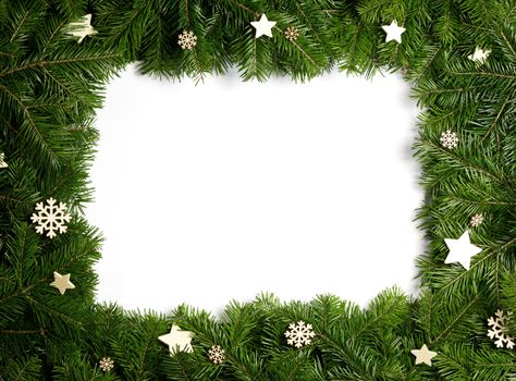 Natural fir Christmas tree border frame and wooden decor isolated on white , copy space for text