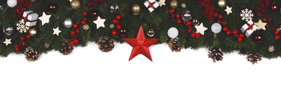 Christmas Border frame of tree branches on white background with copy space isolated, red and golden decor, berries, stars, cones