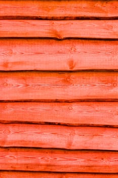 Red wooden boards vertical background. Wall floor or fence exterior design. Natural wood material backdrop