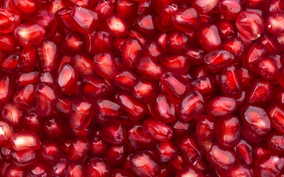 Close-up of pomegranate seeds texture, top view