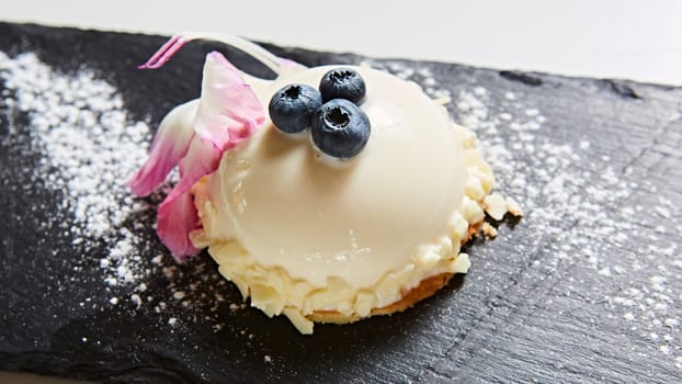 The vanilla mousse with blueberry. Shallow dof