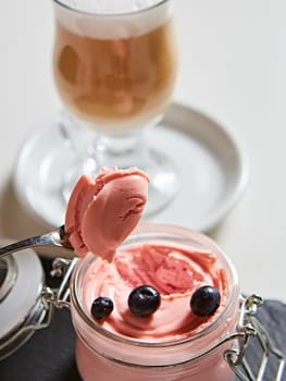 Fresh strawberry yoghurt dessert in glass, selective focus