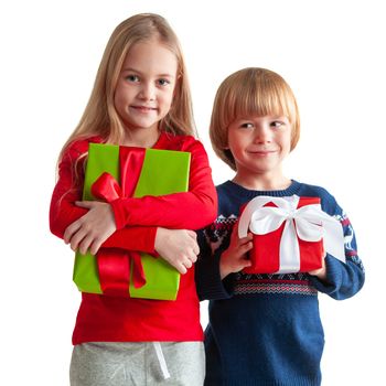 Portrait of two happy children with Christmas gift boxes isolated on white background