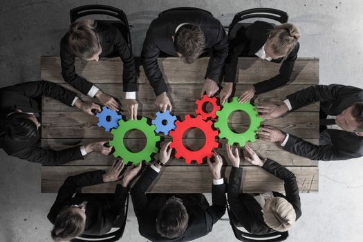 Business people with colorful cogs of business, problem sloution concept