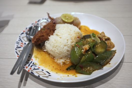 Rice and Spicy stir fry eggplant and minced pork in Rice and Curry Shop at Central Village outlet near Suvarnabhumi , Thailand