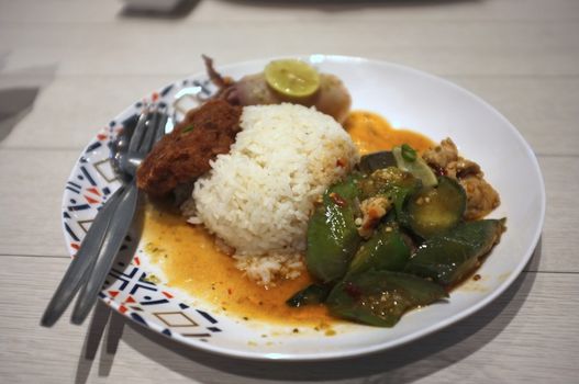 Rice and Spicy stir fry eggplant and minced pork in Rice and Curry Shop at Central Village outlet near Suvarnabhumi , Thailand