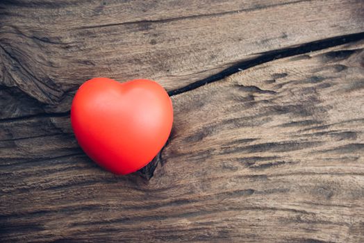 Red heart love on wooden background, valentine day concept